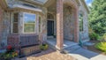 Panorama Whispy white clouds Exterior of a house with red bricks and stone veneer sidings Royalty Free Stock Photo