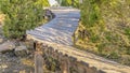 Panorama Winding cantilevered elevated wooden boardwalk with trees