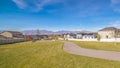 Panorama Winding footpath through a residential estate near sunset