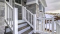 Panorama Winding wooden stairs to a house front door