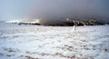 Panorama of winter Fischbacher Alpen with clouds