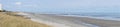 Panorama winter grasses on unpopulated beach with ocean Royalty Free Stock Photo