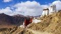 Panorama winter landscape of Leh palace with five color prayer flags blowing in the wind, Leh palace in the background. Royalty Free Stock Photo