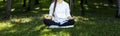 Panorama of woman relaxingly practicing meditation in the pine forest to attain happiness from inner peace wisdom for healthy mind Royalty Free Stock Photo