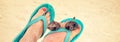 Panorama of woman sandy bare feet with flip flops and sunglasses, vintage style Royalty Free Stock Photo