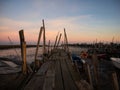 Panorama of wooden pier on stilts boat dock wharf port harbour Cais Palafitico da Carrasqueira Setubal Alentejo Portugal