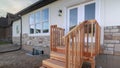 Panorama Wooden steps leading to an elevated front door Royalty Free Stock Photo