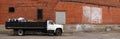 Panorama of Work Truck and Brick Wall