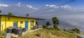 Panorama of a yellow cabin overlooking the Annapurna range in Nepal