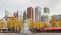 Panorama photo of the statue of William vam Orange on het Plein in the Hague in autumn tones with the sky-line in the background