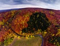 Autumn aerial drone view on curvy road with car. Royalty Free Stock Photo