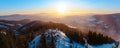 Panoramatic view on mountains from Kralicky Sneznik in winter at sunset.