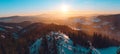 Panoramatic view on mountains from Kralicky Sneznik in winter at sunset.