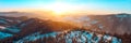 Panoramatic view on mountains from Kralicky Sneznik in winter at sunset.