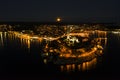Panoramic aerial drone picture of the historic city Rovinj and harbor with full moon in Croatia during sunset Royalty Free Stock Photo