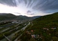 Panoramic aerial drone shot of Nehoiu, a traditional mountain village in Romania. Royalty Free Stock Photo