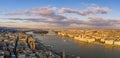 Panoramic aerial drone sunset view of Hungarian Parliament by Danube river with dramatic clouds in Budapest Royalty Free Stock Photo