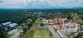 Panoramic aerial drone view of a white mosque known as Tun Khalil Mosque with Mount Ledang background at Asahan, Melaka, Malaysia.