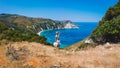 Panoramic aerial photo of a tourist woman enjoying beautiful Petani beach on Kefalonia Ionian island, Greece, during her