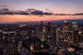 Panoramic aerial skyline view of east London at night with skyscrapers of Canary Wharf and beautiful colorful sky at Royalty Free Stock Photo