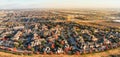 Panoramic aerial view apartment complex and sprawl subdivision with fall foliage near Dallas