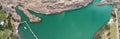 Panoramic aerial view of beautiful green lake in a mountain scenario Royalty Free Stock Photo