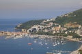 Panoramic aerial view of the city of Budva, the bay with boats and yachts and views of the old city on a sunny day Royalty Free Stock Photo
