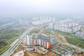 Panoramic aerial view of city construction site in foggy day Royalty Free Stock Photo
