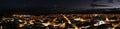 Panoramic aerial view of city showing the brightly lit mainstreet and buildings