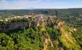 Panoramic aerial view of Civita di Bagnoregio from a flying drone around the medieval city, Italy