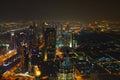 Panoramic aerial view on downtown of Dubai with modern high skyscrapers at night. Architecture of future with bright lights and
