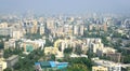 Panoramic aerial view of foggy, polluted, crowded extended suburbs of Mumbai