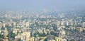 Panoramic aerial view of foggy, polluted, crowded extended suburbs of Navi Mumbai New Bombay