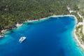 Panoramic aerial view of Foki Beach and sailing yacht boats moored in turquoise bay. Fiskardo, Kefalonia island, Greece Royalty Free Stock Photo