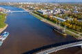 Panoramic aerial view of the Great Bridge and the Volkhov River in Veliky Novgorod, autumn trees on a sunny day. Frigate Royalty Free Stock Photo