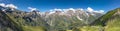 Panoramic aerial view of Grossglockner mountain range covered in snow in summer Austria