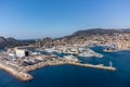 Panoramic aerial view on historical coastal Provencal city La Ciotat with large sailboat harbour and yacht shipyard, summer