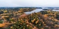 Panoramic aerial view of lake and colorful forests on a autumn day in Finland. Drone photography Royalty Free Stock Photo