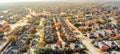 Panoramic aerial view lakeside subdivision with large house and colorful autumn leaves near Dallas