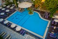 Panoramic aerial view of large swimming pool with bar at luxury tropical hotel apartment resort. Rhodes, Greece, Europe Royalty Free Stock Photo