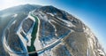 Panoramic aerial view nature and picturesque landscape near a Altay mountain with a green river Katun and bridge on a winter sunny