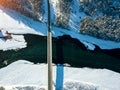 Panoramic aerial view nature and picturesque landscape near a Altay mountain with a green river Katun and bridge on a winter sunny