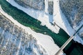 Panoramic aerial view nature and picturesque landscape near a Altay mountain with a green river Katun and bridge on a winter sunny