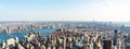 Panoramic aerial view of the rooftops of skyscrapers and districts of central Manhattan as well as the streets of a