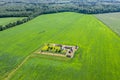 Panoramic aerial view of summer green cultivated fields, farm and forest Royalty Free Stock Photo