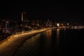 Panoramic aerial view to Benidorm city, Poniente beach, skyscrapers, city lights and Mediterranean sea at night Royalty Free Stock Photo