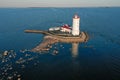 Panoramic aerial view of the Tolbukhin lighthouse. Artificial rocky island in the Gulf of Finland. The oldest Russian lighthouse.