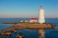 Panoramic aerial view of the Tolbukhin lighthouse. Artificial rocky island in the Gulf of Finland. The oldest Russian lighthouse.