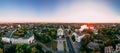 Panoramic aerial view of two old churches near river and bridge in small european city Royalty Free Stock Photo