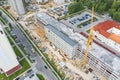 Aerial view of working crane at construction site. multistory parking garage under construction Royalty Free Stock Photo